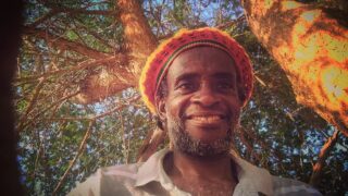 Hi my fans. Am sitting at my meditative spot listening to the birds singing in tree. Rastafari.
